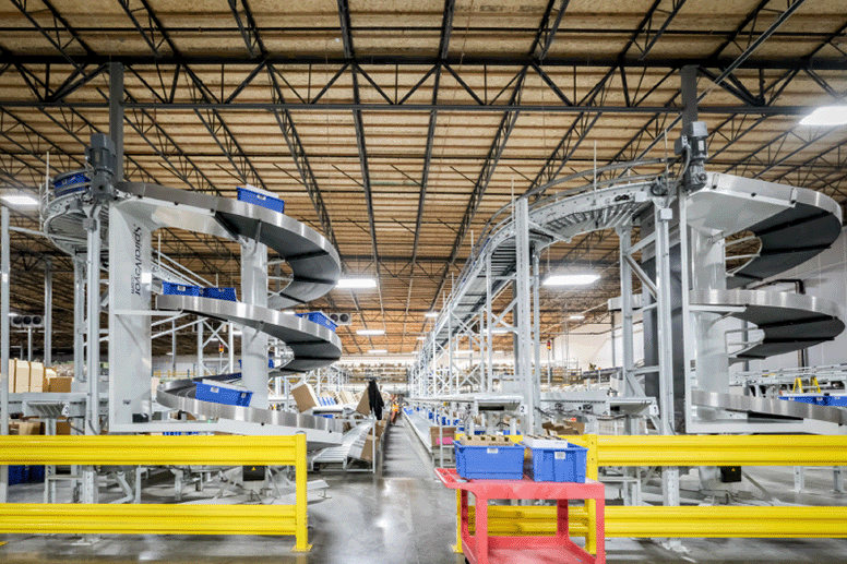 Inside WineDirect's Fulfillment center. Large conveyors moving packages.